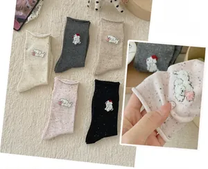 Detail of 5 pairs cotton mid-tube socks with cute puppy embroidery and colorful sprinkles
