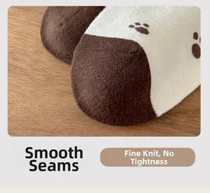 Macro shot of smooth seamless toe stitching and fine knit texture on cartoon cat paw socks