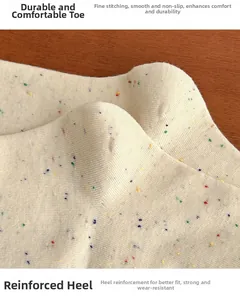 Detail of reinforced heel and flat-sewn toe on cream speckled knit cotton socks