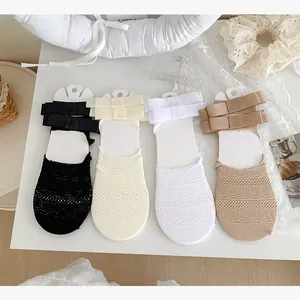 Lace ballet style invisible socks featuring ribbons and bows in four assorted colors