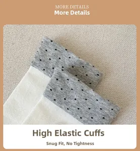 Close-up of high-elasticity ribbed sock cuff with grey polka dots and knitted cotton texture