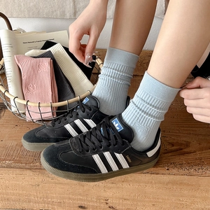 Mid-calf knitted socks featuring cartoon bear patterns in multiple solid pastel colors