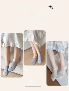 Detail of mesh no-show socks with star patterns and non-slip silicone grip for women