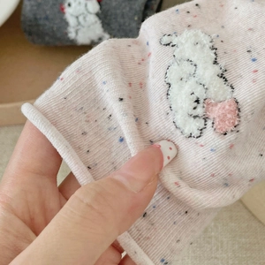 Pink marl knitted socks featuring a fluffy white rabbit patch holding a pink heart