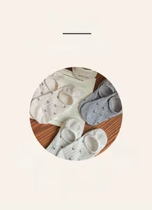Detail of breathable cotton invisible socks with non-slip silicone and bow accents