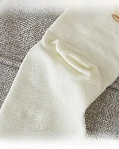 Detail of ribbed knit cotton socks showing reinforced heel and smooth toe seam