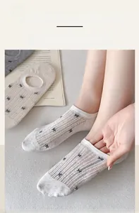 Detail of breathable mesh low cut socks with cute bow embroidery and elastic cuff