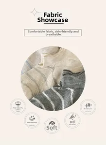 Detail of breathable waffle knit cotton fabric in beige and grey striped pattern