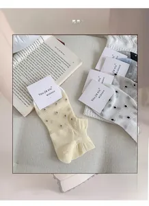 Breathable mesh ankle socks for women featuring colorful polka dots and high elasticity