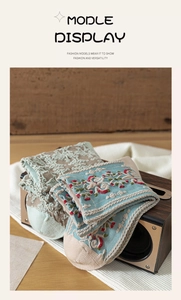 Detail of vintage knit socks with 3D floral relief patterns on rustic wood box