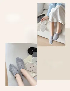 Detail view of mesh bow-pattern invisible socks in grey, beige, white, and black colors