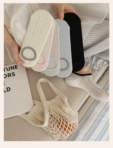 Close-up of five colorful low cut invisible socks with silicone anti-slip heel grips