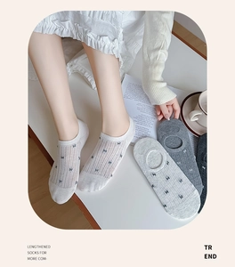 Close-up of low cut invisible socks with bow jacquard pattern and non-slip silicone edge