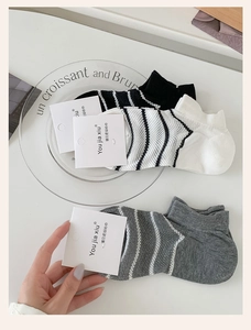 Three-pack of striped breathable low-cut socks in black, white, and grey colors