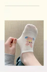 Close-up of beige low cut socks showing high elastic stretch and cute rabbit patterns