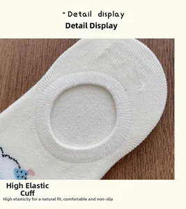 Detail view of high elasticity ribbed cuff on cartoon white invisible cotton blend socks