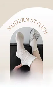 Detail of white mesh crew socks with geometric knit patterns and ruffled lettuce edge trim