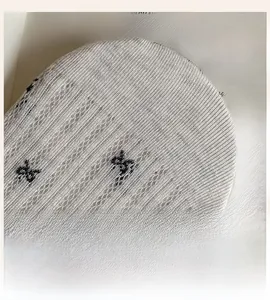 Detailed close-up of seamless knit toe construction on grey lightning pattern socks