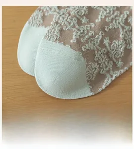 Detail of vintage palace style cotton socks showing seamless toe and embossed pattern