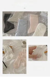 Detail of five pairs of pastel socks with scalloped edges and breathable mesh texture