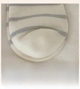 Detailed macro view of the seamless toe construction on grey and white striped socks