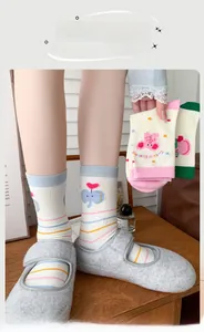 Detail of colorful striped elephant socks with heart patterns in soft cotton blend