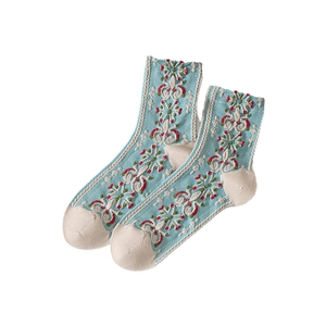 Vintage light blue crew socks with floral embossed pattern and reinforced beige heel