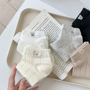 Five pairs of low-cut ribbed socks with cute bear embroidery in a mix of neutral colors