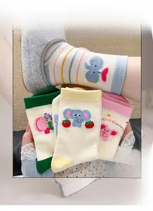 Detail of high elasticity elephant cartoon socks in pastel colors with ribbed cuffs