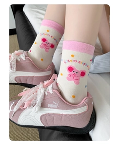 Detail of pink elephant cartoon socks with cute dot patterns and ribbed cotton cuffs