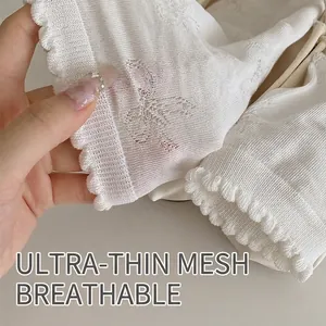 White ultra-thin mesh socks for women featuring elegant ruffled cuffs and hollow knit design