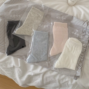 Five-pack of sheer hollow-out heart crew socks for women in soft pastel cotton blend