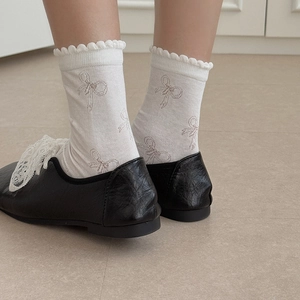 Elegant hollow bow tie crew socks for women featuring vintage lace trim and retro patterns