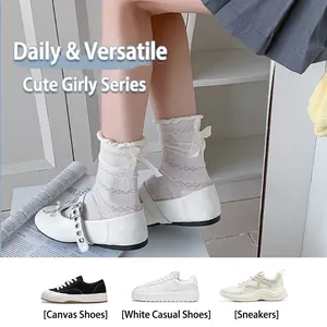 White lace mesh crew socks with ribbon bow detail and stylish hollow wave patterns