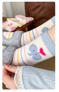 Close-up of cute cartoon elephant embroidery on striped cotton crew socks for women