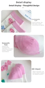 Detail view of elastic cuff, flat toe seam and durable heel of pink cartoon socks