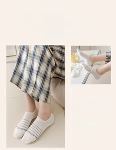 Detail of breathable low cut invisible socks with letter print and stripe patterns