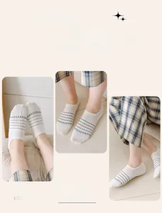 Detail of white cotton no-show socks with blue stripes and double needle weaving texture