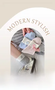 Close-up of pastel dot yarn socks with decorative buttons and ribbed elastic cuffs
