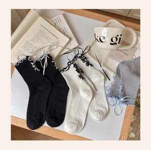 Detailed knit texture and ribbon bow design on these Japanese Lolita style socks