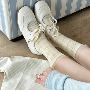 Lace ruffle striped crew socks with plaid pattern and white Mary Jane flat shoes