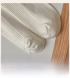 Close-up of seamless toe stitching on white ribbed knit cotton Lolita socks