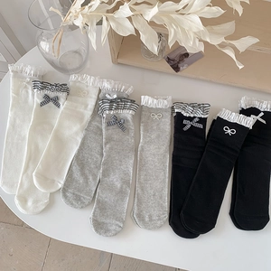 Sweet lace ruffle socks with bows in white, grey, and black colors for a lolita look