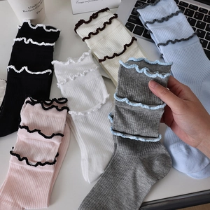 Lace trim ribbed crew socks in multiple colors with lettuce edge and contrast stitching