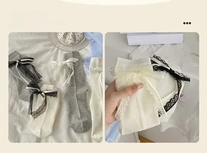 Detail showing knit ribbon bow and vertical stripes on white lace lolita socks
