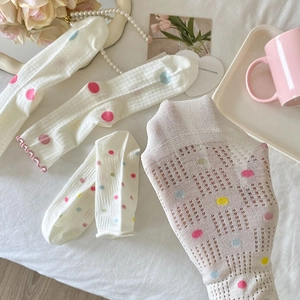 Sheer white mesh socks with colorful polka dots in a breathable summer style