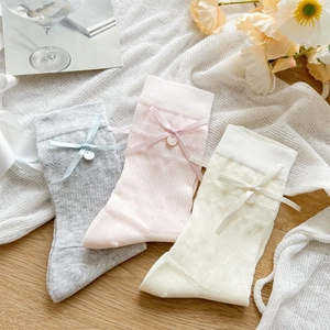 Detailed knit texture and silk bows on pastel sweet lolita mid-calf socks