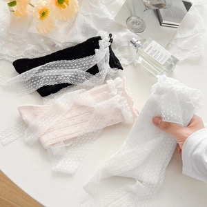 Detailed view of sweet Lolita socks with lace trim and polka dot ribbons in three colors