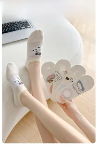 Close-up of thin mesh no-show socks with cute cartoon animal patterns and agaric lace edge