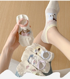 Close-up of five pairs of breathable cartoon animal socks in soft pastel candy colors